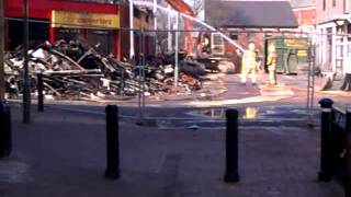 Lancashire Fire and Rescue Appliance Crews Dampen remains of Cash Converters in Chorley Town Centre