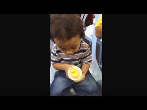 Ishaq eating cupcakes