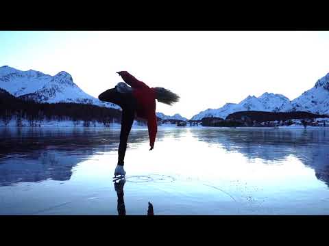 Girl Performs Amazing Ice Skating Act Amidst Mountains In Switzerland - 1181647