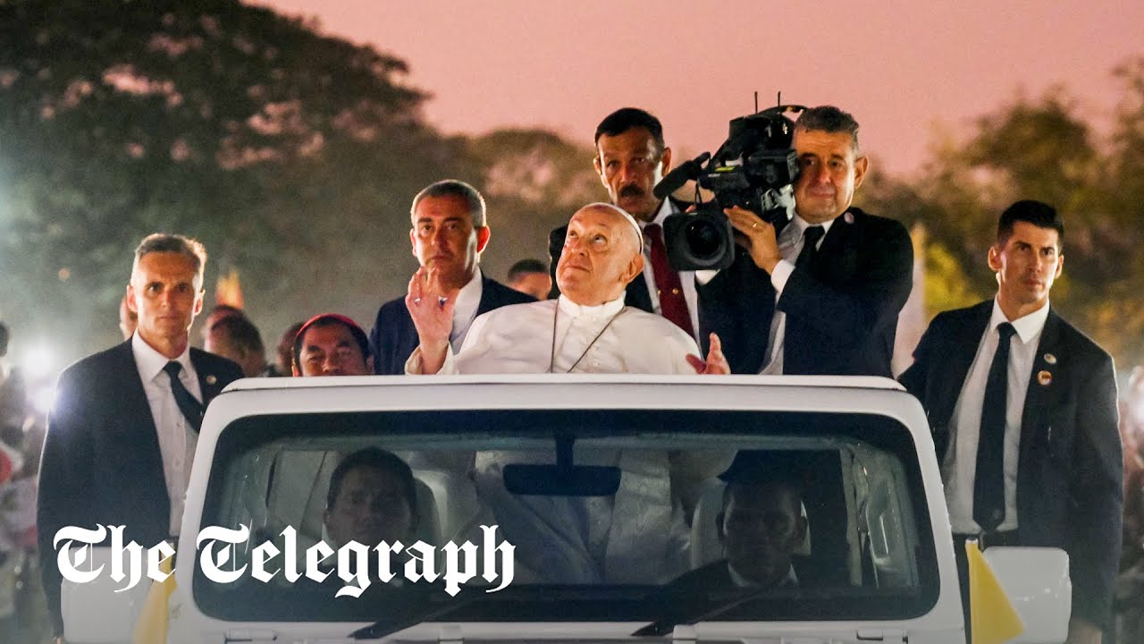 Pope Francis waves from open-topped popemobile as he's welcomed by half of East Timor