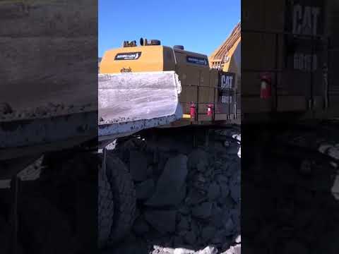 Caterpillar 6015B Excavator Loading Caterpillar 777D Dumpers