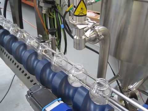 Riggs Autopack Ltd - Bottle Filling Scroll Feed Conveyor