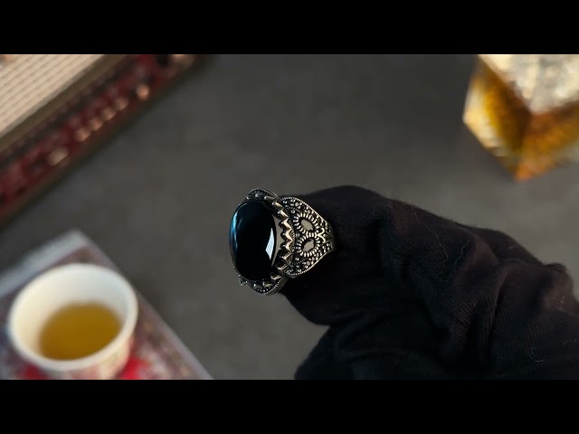 Men's silver ring decorated with black onyx stone