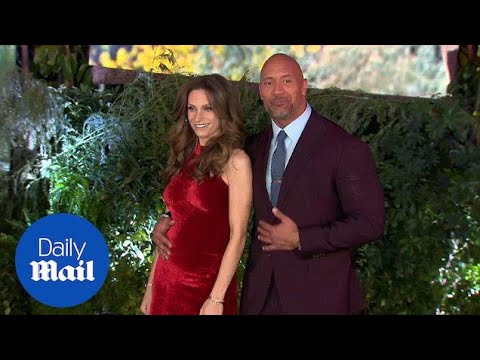 Dwayne Johnson cosies up to pregnant girlfriend at Jumanji premiere - Daily Mail