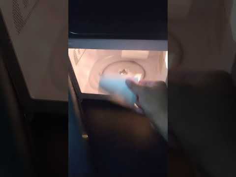 TWO STYROFOAM CUPS IN THE MICROWAVE