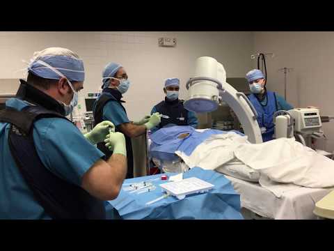 Dr. Sammarone taking pictures of the Spine