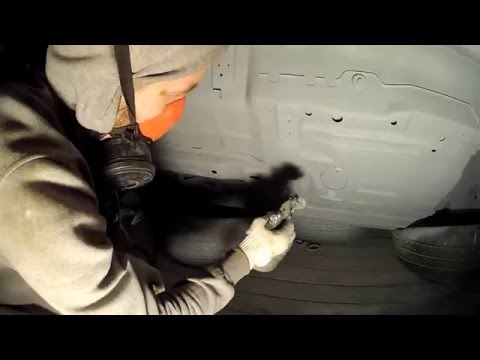 95 Deville underbody paint job in a garage