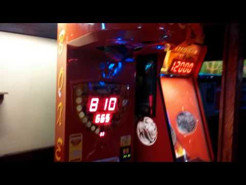 This Girl Purposely Misses Bag On Punching Machine Bar Game To Clock Dude In Face