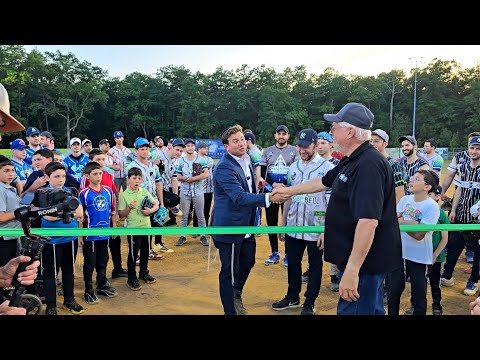 Mayor Ray Coles throws out the 1st Pitch at the Pease Bell Ribbon Cutting ceremony by LBA League's.