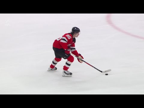Jack Hughes scores a goal against the New York Rangers