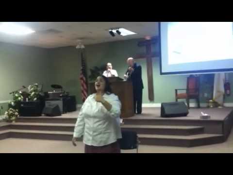 Pastor Ramsey and wife singing