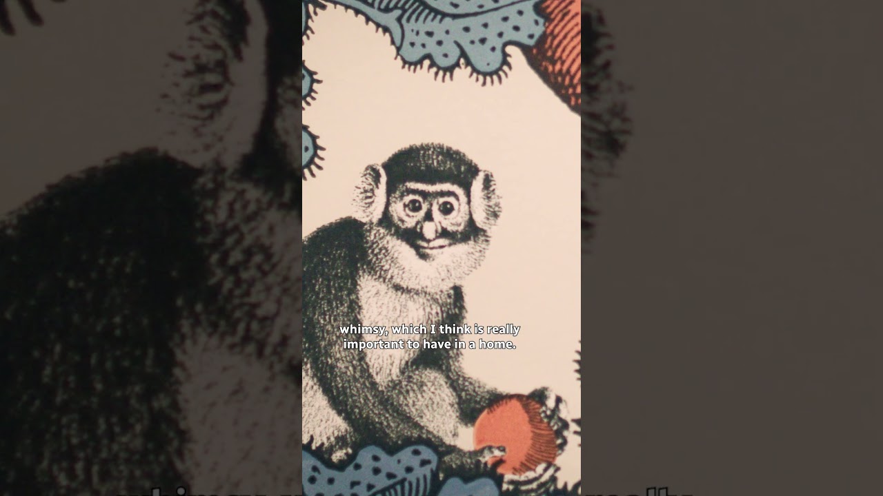 A fun entryway with whimsical wallpaper that “goes all the way up!”