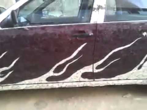 Mozaic car with shards of glass and mirrors made by Arber zeneli