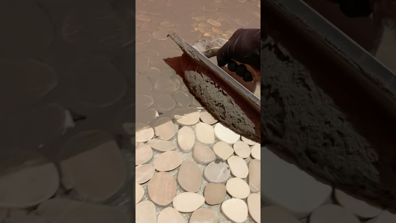 Grouting pebbles #tile #diy #construction #howto