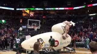 The Milwaukee Bucks Rim Rockers jumping OVER the Bucks Blimp at half time