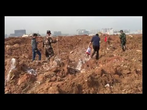 Shenzhen landslide survivors search for buried family with app, lime mark