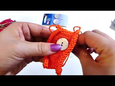 Sewing buttons onto knitted pieces