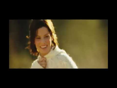 Trailer frame of Kate looking back at the shoreline, the piano theme tapering into silence