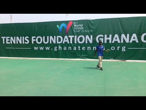 Tennis Presentation of trophy to the boys Singles winner Abubakari Yakubu Lea