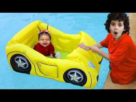 Sami and amira play with inflatable cars