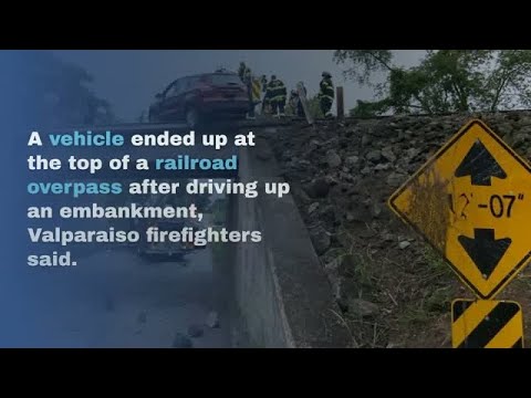 WATCH NOW: Vehicle drives up embankment, crashes onto train overpass