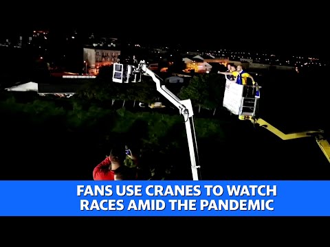 Polish fans use cranes to watch races amid the pandemic