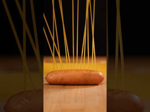 Average size sausage wrapped in spaghetti and cheese 🍝