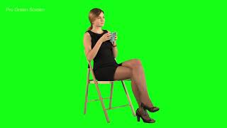 Girl sitting on chair and driking coffee Green Scr