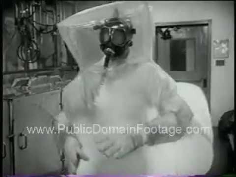 Man in Atomic Suit Preparing to Handle Radioactive Material Footage PublicDomainFootage.com