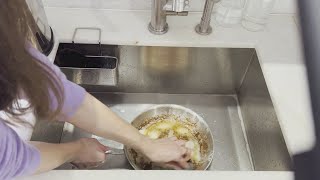Watch Baking Soda + Lemon INSTANTLY Dissolve Caked-On Grease In Pan