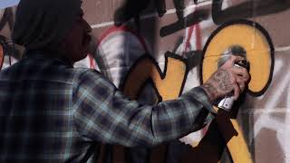 Graffiti - Mr Oz spraying "Las Vegas" in an alley of the arts district
