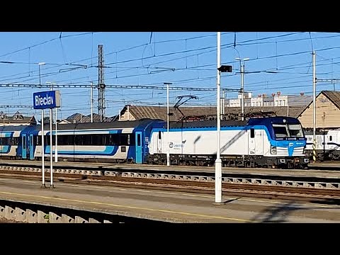 A blue passenger train arrives at Breclav station, Czech Republic.