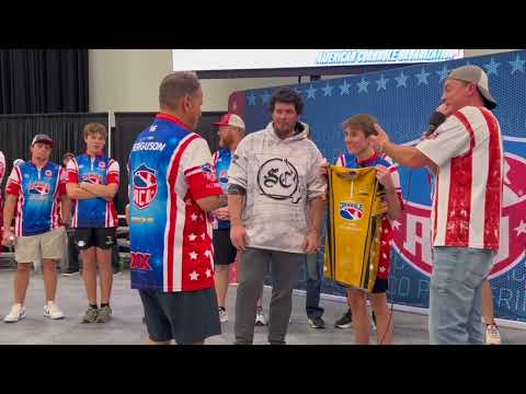 ACO King of Cornhole Isaac Hurt is presented with his King Ring