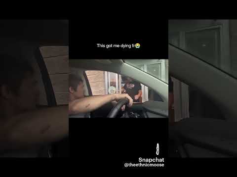 man jumps out of car onto drive thru window