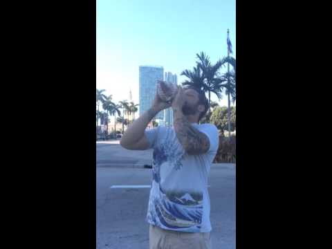 Triton/conch shell blowing