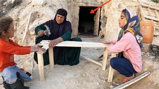 Mahijan grandmother's carpentry skills: making a wooden platform in a mountain cave