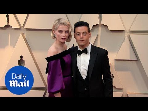 Love Doves! Rami Malek and Lucy Boynton embrace at 2019 Oscars