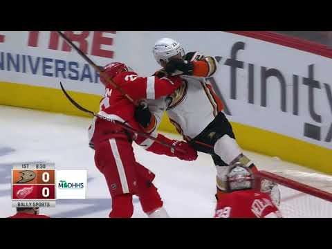 Detroit Red Wings Lindstrom sends Anaheim's Steel into orbit.
