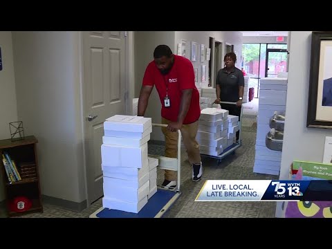 Volunteers deliver thousands of books to area schools