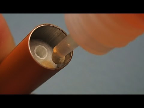 Part of a video titled How To Save Money Refilling Electronic Cigarette Cartomizers