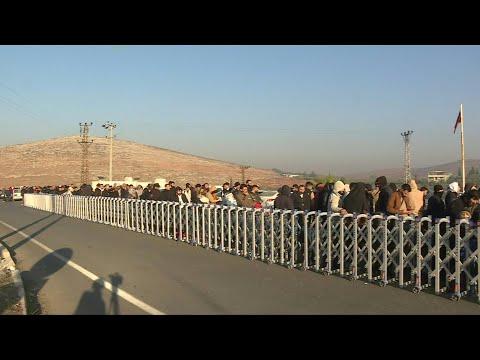Crowds gather at the Turkey-Syria border following rebels' ouster of Assad | AFP