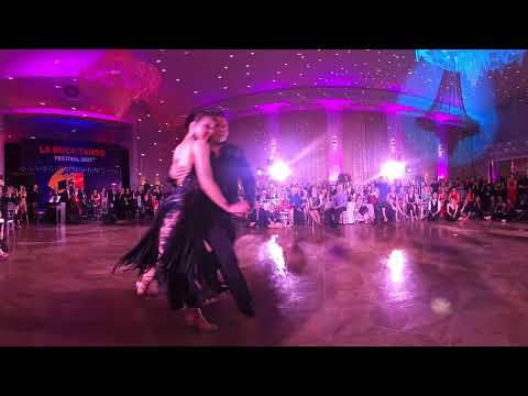  Maria Marinova  and  Sebastian Arce  are  dancing  to  the  milonga  "  Oro y plata  "  by  Forever Tango  at  La Boca Tango Festival  in  2021