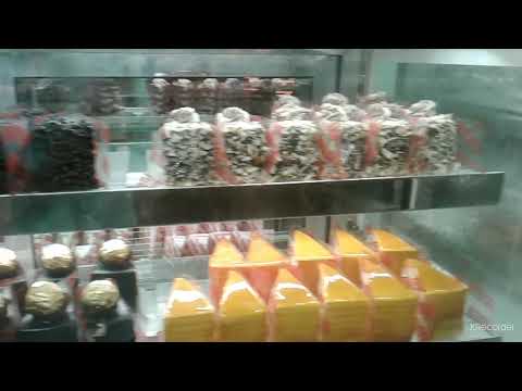 selecting the birthday  cake on senthil bakery