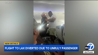 Download lagu Unruly passenger yelling racist slurs restrained by man during flight to LA mp3