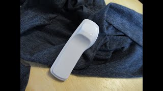 Removing a store security tag from clothing