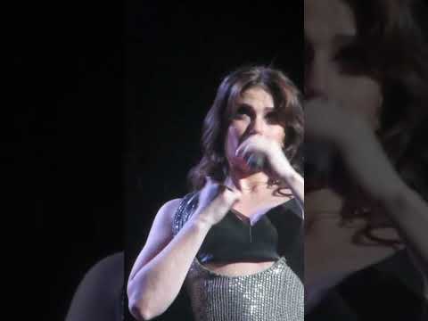 Idina Menzel handling her wardrobe malfunction like a boss during Take Me Or Leave Me