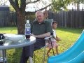 Family Sitting In The Backyard Relaxing Before Barbeque 05 28 2006