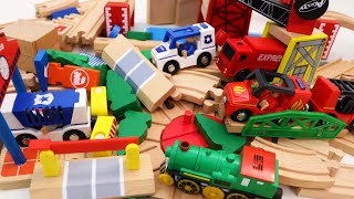 Download the video "Wooden Train Tracks with Movable Bridge - Fire Truck, Police Car, Excavator Toys"