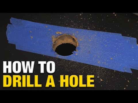 Part of a video titled How To Drill A Hole In An IKEA Linnmon Desk - YouTube