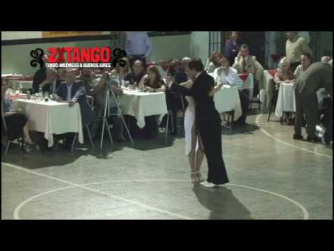  Maria Belen Bartolomé  and  Maximiliano Cristiani  are  dancing  to  the  tango  "  Junto A Tu Corazon  "